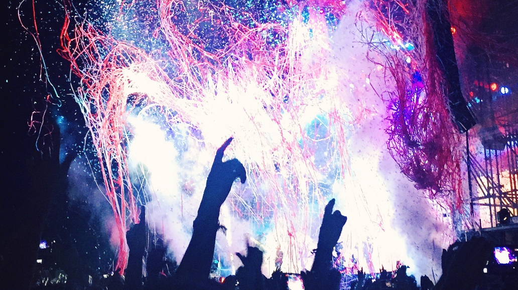 fireworks at a concert, more hands up